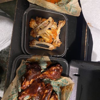 Wingstop - two trays of food on a table - Chicken Wings Near Me - Akron, Ohio Wingstop - two trays of food on a table - Chicken Wings Near Me - Akron, Ohio