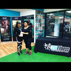 LTG Fitness - Client receives LTG Fitness Personal Training Journal with owner Tye Jacobs a