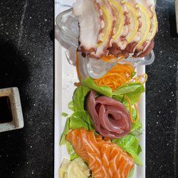Kobe Seafood & Steakhouse - Tako (Octopus), tuna and salmon sashimi on a bed of baby spinach, carrots and ice.