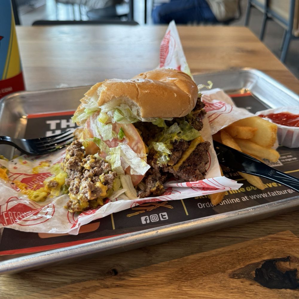 Fatburger - The Double Fatburger w/Cheese (2/3 lb.) Meal with an egg fell apart when I picked it up. The patties tore in two unable to hold cohesion. - Burgers Near Me - Celebration, Florida