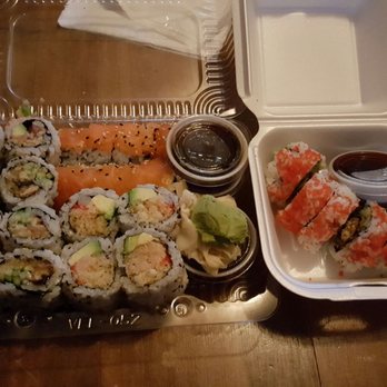 Sushi Bonsaï - a tray of sushi and a container of sauce - Sushi Bars Near Me - Montreal, Quebec Sushi Bonsaï - a tray of sushi and a container of sauce - Sushi Bars Near Me - Montreal, Quebec