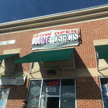 Wine Districts - a man standing in front of a wine district - Beer, Wine & Spirits Near Me - Frederick, Maryland