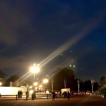 Buckingham Palace - 12/10/2018: Statue with a faint image of London Eye in the distance. - Landmarks & Historical Buildings Near Me - London, XGL Buckingham Palace - 12/10/2018: Statue with a faint image of London Eye in the distance. - Landmarks & Historical Buildings Near Me - London, XGL