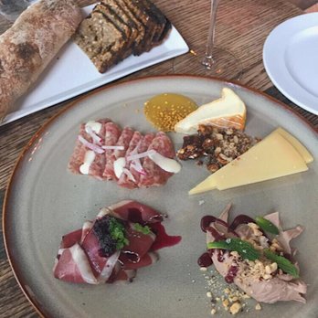 Table, Donkey and Stick - Charcuterie: Duck Liver Mousse, Duck Prosciutto, and Honey White Pepper Salame. Cheese: Saxony and a soft Vacherousse. - Modern European Near Me - Chicago, Illinois