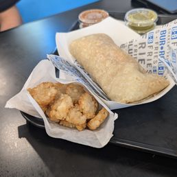 Chorizo breakfast burrito & tater tots Chorizo breakfast burrito & tater tots
