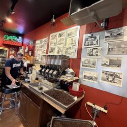 Mojo Coffee Co - Owner is grinding and resealing our coffee beans for us