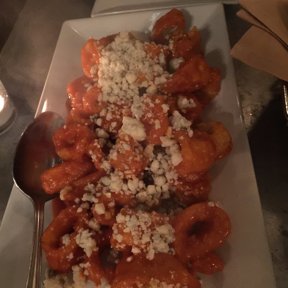 Bistro 1051 - Buffalo calamari with crumbled blue cheese. - Italian Near Me - Clark, New Jersey Bistro 1051 - Buffalo calamari with crumbled blue cheese. - Italian Near Me - Clark, New Jersey