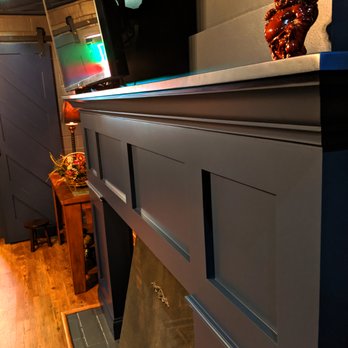 MoBA Construction - a fireplace with a tv above it - General Contractors Near Me - Peoria, Illinois MoBA Construction - a fireplace with a tv above it - General Contractors Near Me - Peoria, Illinois