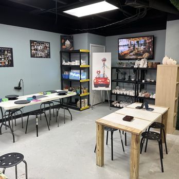 Stroke Of Art - Glazing area with some games available while you're waiting for your piece to dry. - Paint-Your-Own Pottery Near Me - Orlando, Florida Stroke Of Art - Glazing area with some games available while you're waiting for your piece to dry. - Paint-Your-Own Pottery Near Me - Orlando, Florida