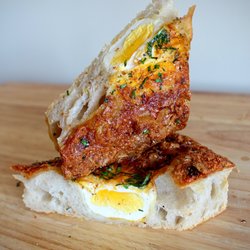 Ocelot Cafe & Bakery - Breakfast Focaccia * Egg baked into every slice.