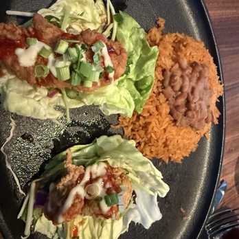 Yard House - Korean Spicy Chicken tacos served as lettuce wraps - New American Near Me - Vernon Hills, Illinois Yard House - Korean Spicy Chicken tacos served as lettuce wraps - New American Near Me - Vernon Hills, Illinois