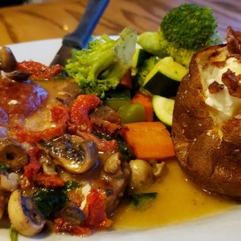 Good Life Cafe - Pork Chop stuffed with sun dried tomatoes, artichoke, spinach and mushrooms with baked potato - Vegetarian Near Me - Mammoth Lakes, California