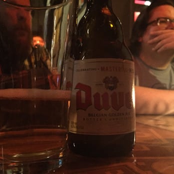 The Standard - a bottle of beer on a table - Bars Near Me - Milwaukee, Wisconsin The Standard - a bottle of beer on a table - Bars Near Me - Milwaukee, Wisconsin