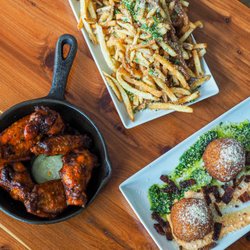 Retreat Gastropub - A variety of our Happy Hour snacks - Parmesan French Fries (fries made in house), Risotto Balls, Chicken Wings