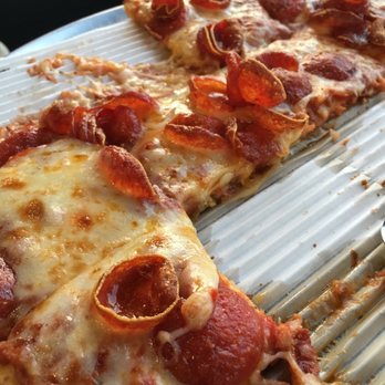 Marco's Pizza - This the crispy thin with old world pepperoni. It is a round pizza cut into squares. - Pizza Near Me - Northport, Alabama Marco's Pizza - This the crispy thin with old world pepperoni. It is a round pizza cut into squares. - Pizza Near Me - Northport, Alabama