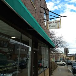 Karin Menzel Violins - There's a cool, vintage sign out front, but the entrance is on the side.
