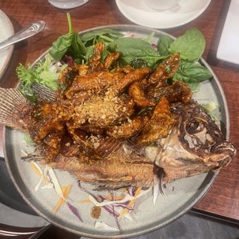 Baan Thai Cuisine - Garlic fried tilapia - Thai Near Me - Humble, Texas Baan Thai Cuisine - Garlic fried tilapia - Thai Near Me - Humble, Texas