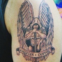 Crooked lettering and this guy clearly doesn't look up the anatomy of any creatures he tattoos. Wings don't work like this. poor shading