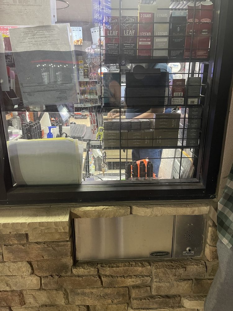 Chevron - a man in a store looking out a window - interior - Gas Stations Near Me - Ripon, California Chevron - a man in a store looking out a window - interior - Gas Stations Near Me - Ripon, California