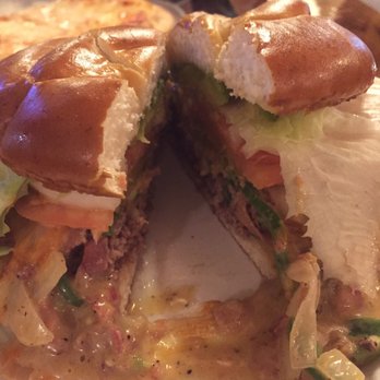 The Alibi Lounge - Jalapeno burger cut in half - Bars Near Me - Shelby, Montana