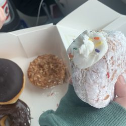Rise and Shine Doughnut Cafe - In box: coconut key lime, Boston creme (sweet heavens!), chocolate glazed and vanilla filled powdered donut.