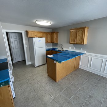 Tekton Carolinas - a kitchen with blue counter tops - General Contractors Near Me Tekton Carolinas - a kitchen with blue counter tops - General Contractors Near Me