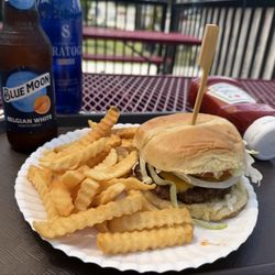 Cheeseburger, fries, beer & bottled water on the patio