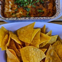 Queso fundido with chorizo and tortilla chips Queso fundido with chorizo and tortilla chips