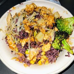 BIBIBOP Asian Grill - Spicy Chicken Bowl...w/ purple rice, potatoes, bean sprouts, corn, broccoli, teriyaki sauce, & Yum-Yum sauce.