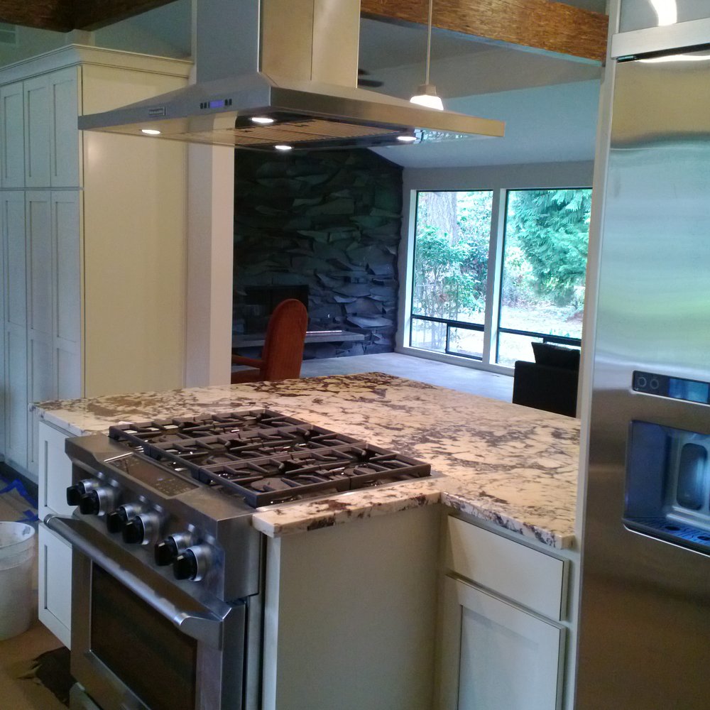 they just got done installing island granite counter top. they just got done installing island granite counter top.