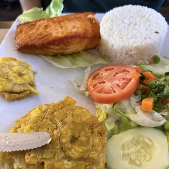 Rincon Limeño - Salmon à la grill (grilled salmon with rice, salad, and green plantain). - Latin American Near Me - Boston, Massachusetts Rincon Limeño - Salmon à la grill (grilled salmon with rice, salad, and green plantain). - Latin American Near Me - Boston, Massachusetts