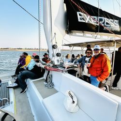 Express Watersports - The boat, passengers and a crew member.