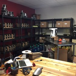 Kintore Coffee - The roasting and weighing coffee beans behind the cash.