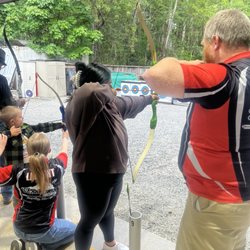 Skookum Archers - Hands on practice from staff with my wife shooting.