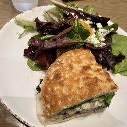 Half of a Bella Portobella sandwich with a side salad split in the kitchen. Yummm! Half of a Bella Portobella sandwich with a side salad split in the kitchen. Yummm!