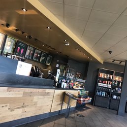 a coffee shop with a counter and shelves