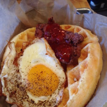 Kimchi Grill - Korean fried chicken waffle taco served with organic blue agave nectar butter topped with a fried egg - Korean Near Me - Brooklyn, New York