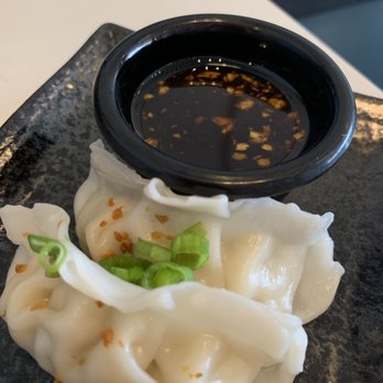 Spoon & Fork Kitchen - Chicken dumplings appetizer, again we ate most before photo. - Thai Near Me - Austin, Texas Spoon & Fork Kitchen - Chicken dumplings appetizer, again we ate most before photo. - Thai Near Me - Austin, Texas
