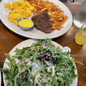 Toast Kitchen & Bar - Steak And Eggs w/urugala salad - Breakfast & Brunch Near Me - Brea, California Toast Kitchen & Bar - Steak And Eggs w/urugala salad - Breakfast & Brunch Near Me - Brea, California