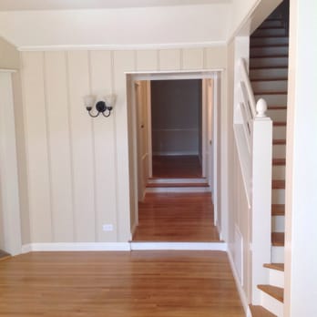 Finest Flooring - a hardwood floor and a staircase - Flooring Near Me