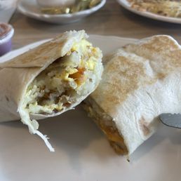 Bacon Breakfast burrito, delicious! Came with a side of sour cream & salsa.