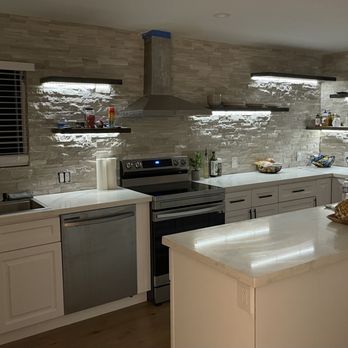Make It Simple - a kitchen with white cabinets and stainless steel appliances - General Contractors Near Me Make It Simple - a kitchen with white cabinets and stainless steel appliances - General Contractors Near Me