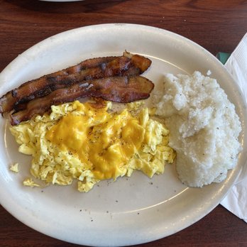 Dontee's Diner - Scrambled Eggs with cheese, grits and 3 slices of bacon. - Breakfast & Brunch Near Me - West Palm Beach, Florida Dontee's Diner - Scrambled Eggs with cheese, grits and 3 slices of bacon. - Breakfast & Brunch Near Me - West Palm Beach, Florida