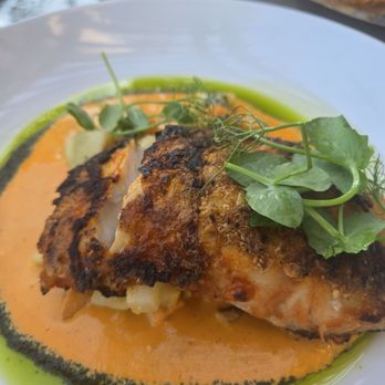 Chandler's Oceanfront Dining - Charred sea bass with pesto and basil oil. Yes. Fave fish dish. - New American Near Me - Carlsbad, California