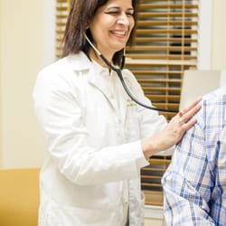 Holy Cross Health Partners Progressive Medical Care - Dr. Naqvi examining Patient