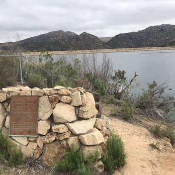 The Harry W Frame Dam - 3.7.21 The dam underlying the mountains above the plaque marker and gated entrance - Lakes Near Me - Poway, California