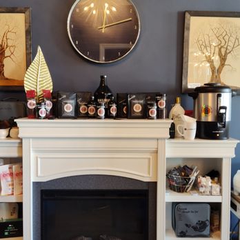 Railhead Coffee Co - a fireplace with a clock above it - Coffee Roasteries Near Me - Tulsa, Oklahoma