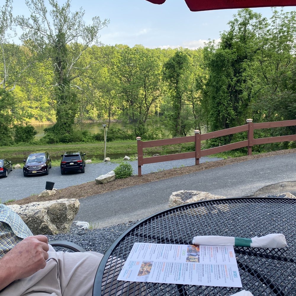 The lron Mule - a man sitting at a table outside - Bars Near Me - Easton, Pennsylvania The lron Mule - a man sitting at a table outside - Bars Near Me - Easton, Pennsylvania