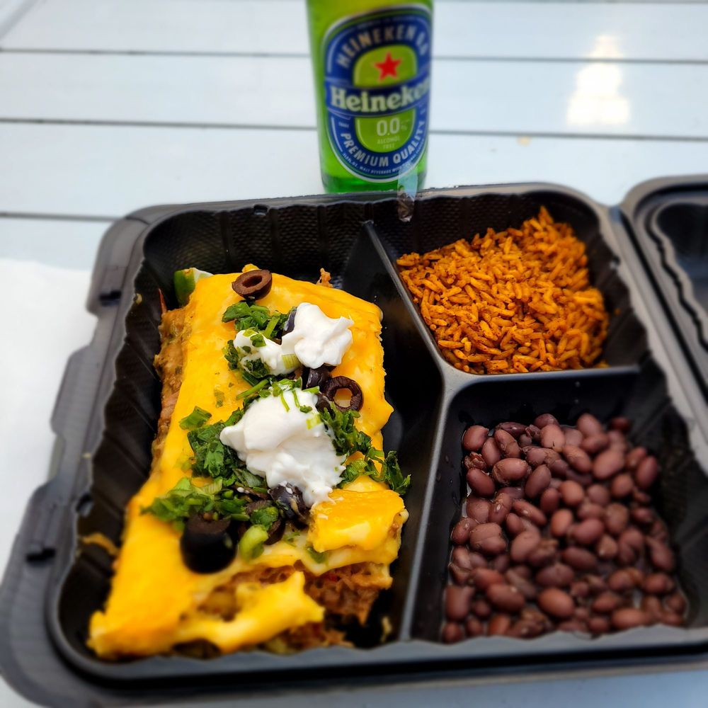 a meal of enchilada, beans, and rice a meal of enchilada, beans, and rice