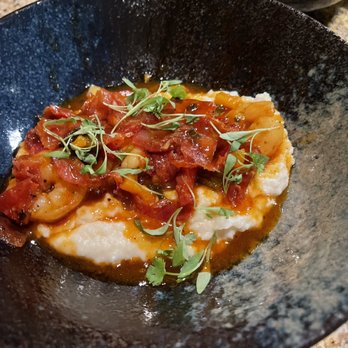Asador - Shrimp and Grits drowned in a sauce with bacon. - American Near Me - Dallas, Texas Asador - Shrimp and Grits drowned in a sauce with bacon. - American Near Me - Dallas, Texas